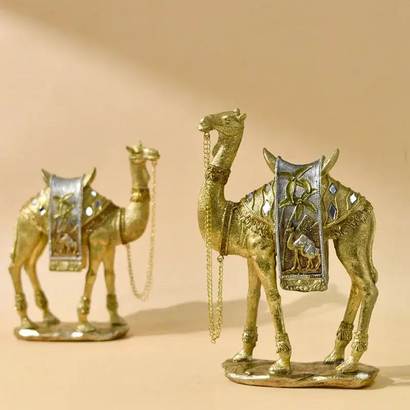 Golden camel resin sculpture set with intricate silver and mirrored embellishments for decorbites golden office decor