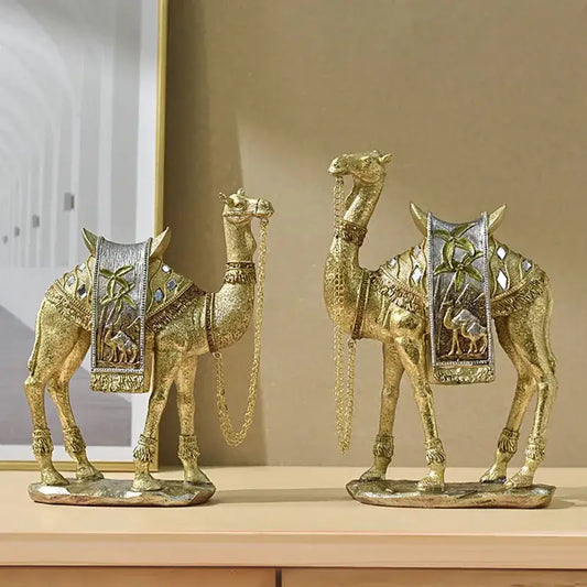 Two decorbites golden camel resin sculptures with ornate gold and silver embellishments for office decor