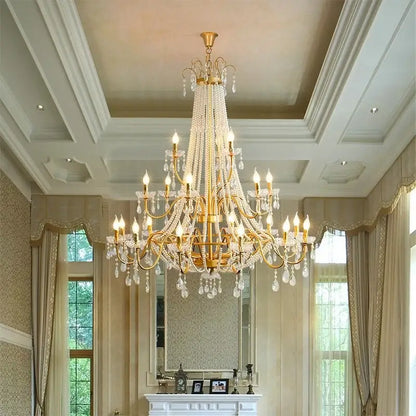 Golden cascading crystal led chandelier pendant light with clear crystal droplets and candle-style bulbs for villa stairs decorbites crystal led