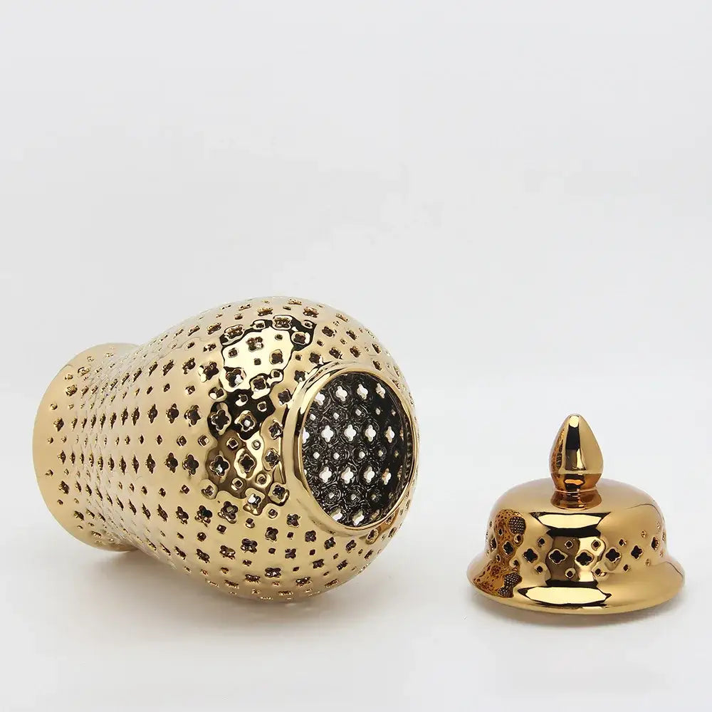 Golden ceramic ginger jar with intricate geometric cutouts and matching lid for home decor by decorbites golden ceramic
