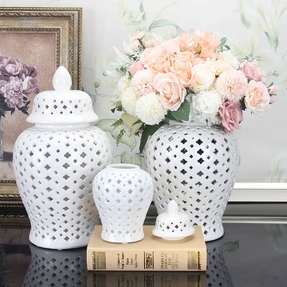 White ceramic ginger jars with intricate diamond cutouts and lids in varying sizes for home decor by decorbites golden ceramic