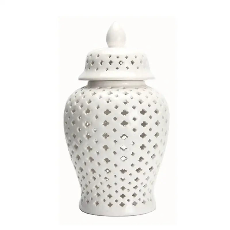 White ceramic ginger jar with matching lid and diamond-shaped cutouts for decorbites golden ceramic home decor