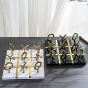 Decorbites golden chessboard metal handicraft tic-tac-toe set with gold pieces on white and black marble bases for living room decor