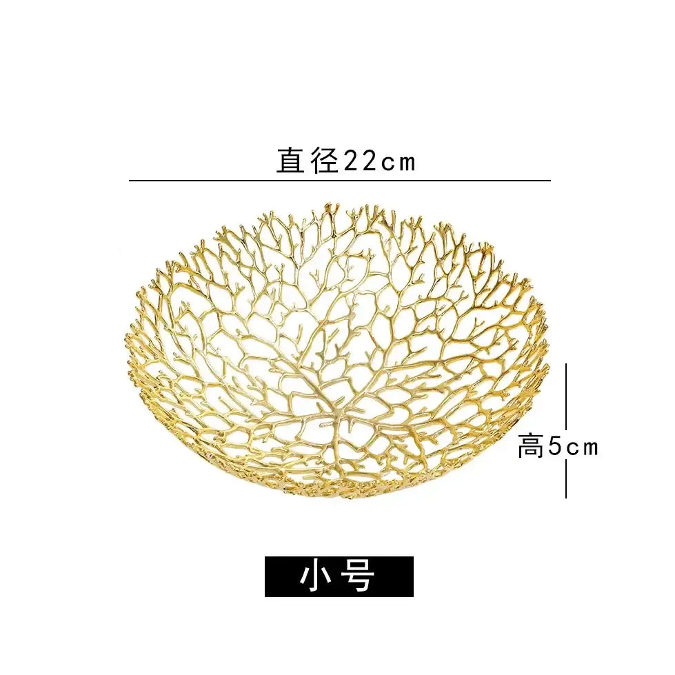 Gold-colored intricately woven metal tray with coral shapes from decorbites used as dining room fruit bowl