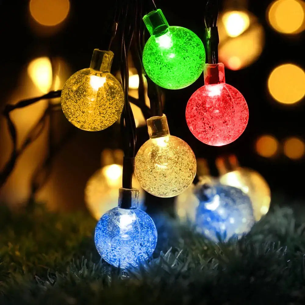 Colorful golden crackled glass crystal ball solar fairy lights with vibrant red green yellow blue hues for garden decor