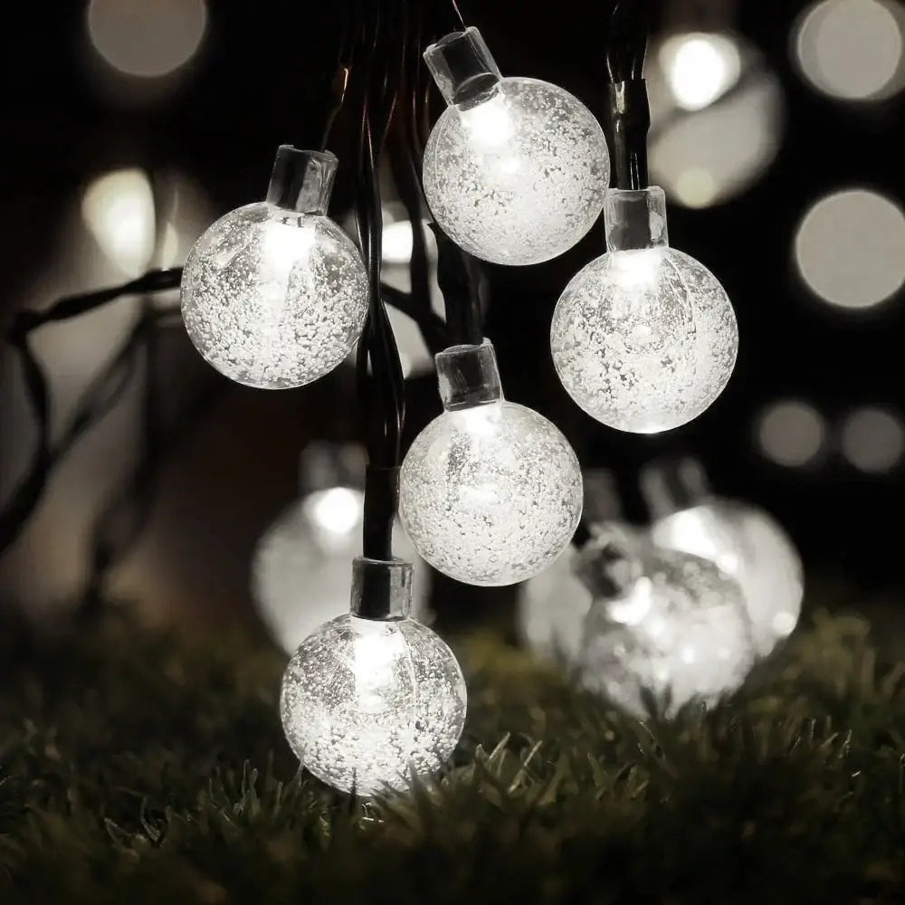 Golden crackled glass crystal ball solar fairy lights feature clear spherical glass with frosted texture and warm white glow