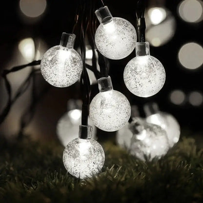 Golden crackled glass crystal ball solar fairy lights feature clear spherical glass with frosted texture and warm white glow