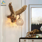 Golden crystal eagle wall lamp with detailed feathered wings and a crystal globe lampshade for living room decorbites crystal eagle