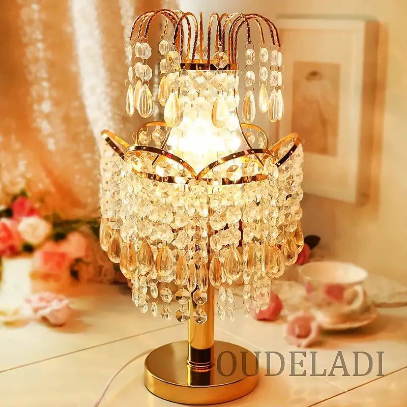 Golden crystal table lamp with cascading teardrop and faceted crystals for bedroom decor by decorbites crystal table