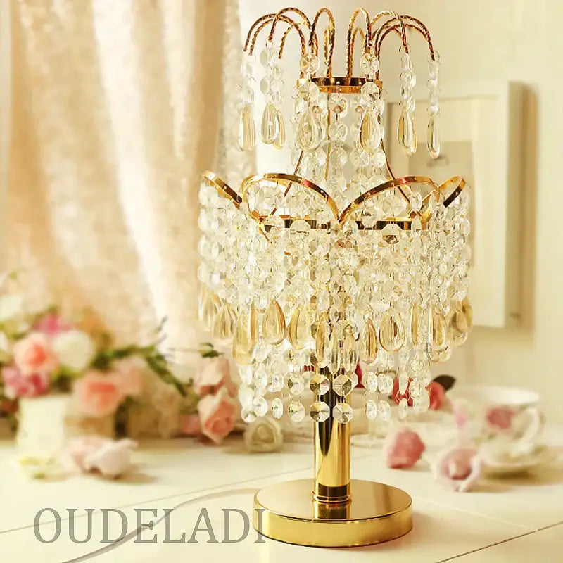 Golden crystal table lamp with tiered clear teardrop crystals and gold-toned metal for decorbites crystal table decor