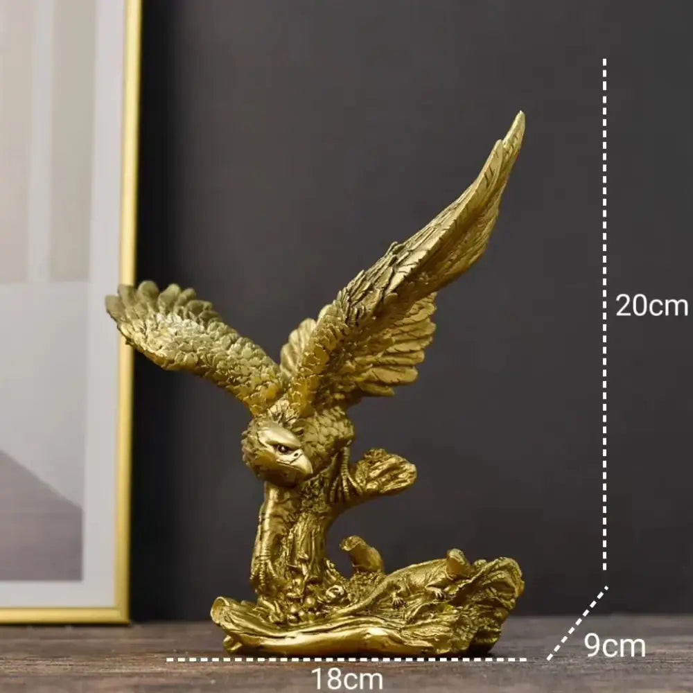 Golden dapeng eagle wings resin statue with detailed feathering on rocky base for office decor by decorbites dapeng eagle