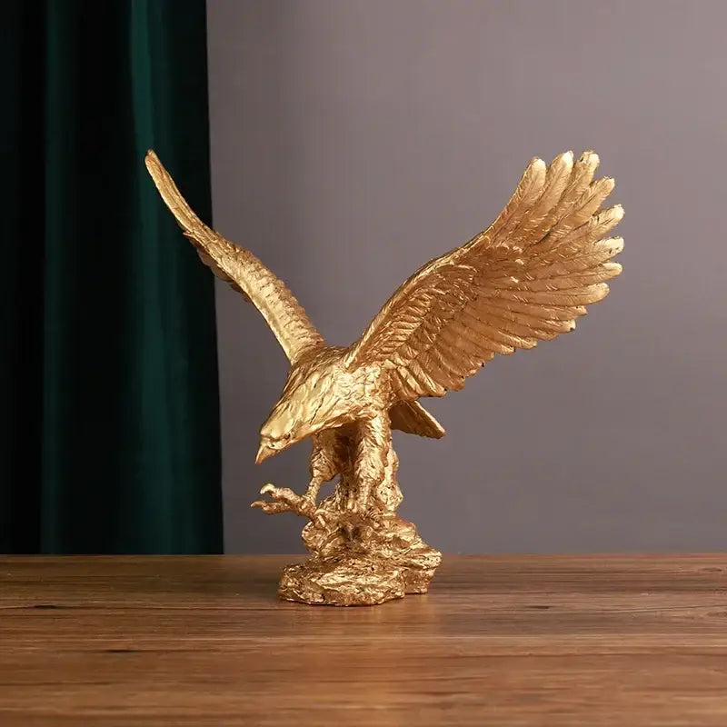 Golden dapeng eagle wings resin statue with detailed feather texture perched on rocky base for office decorbites decor