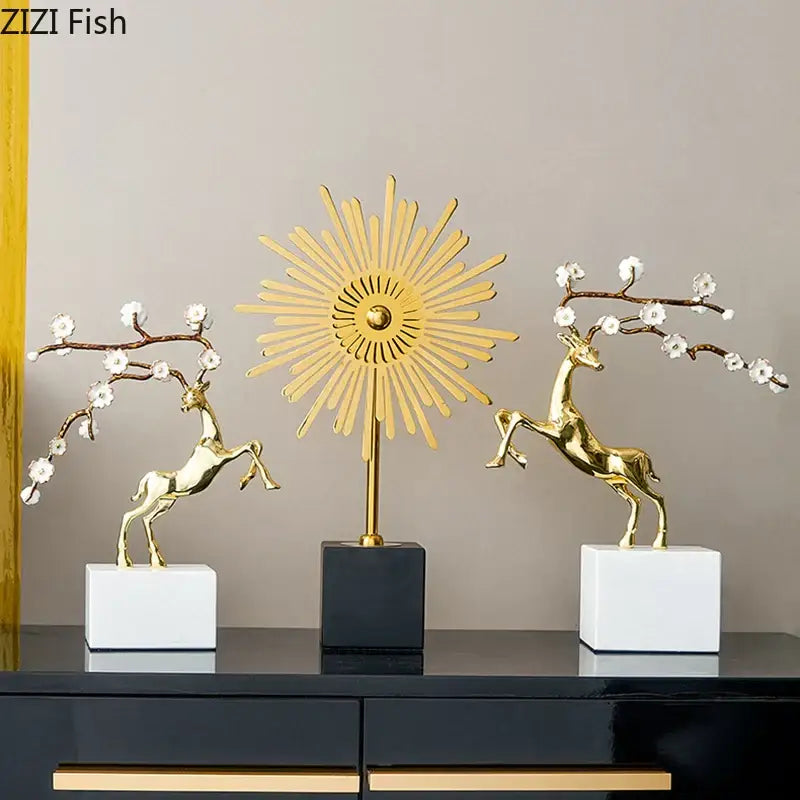 Golden deer antlers statue by decorbites featuring polished metal with white blossoms on sleek white bases for living room decor