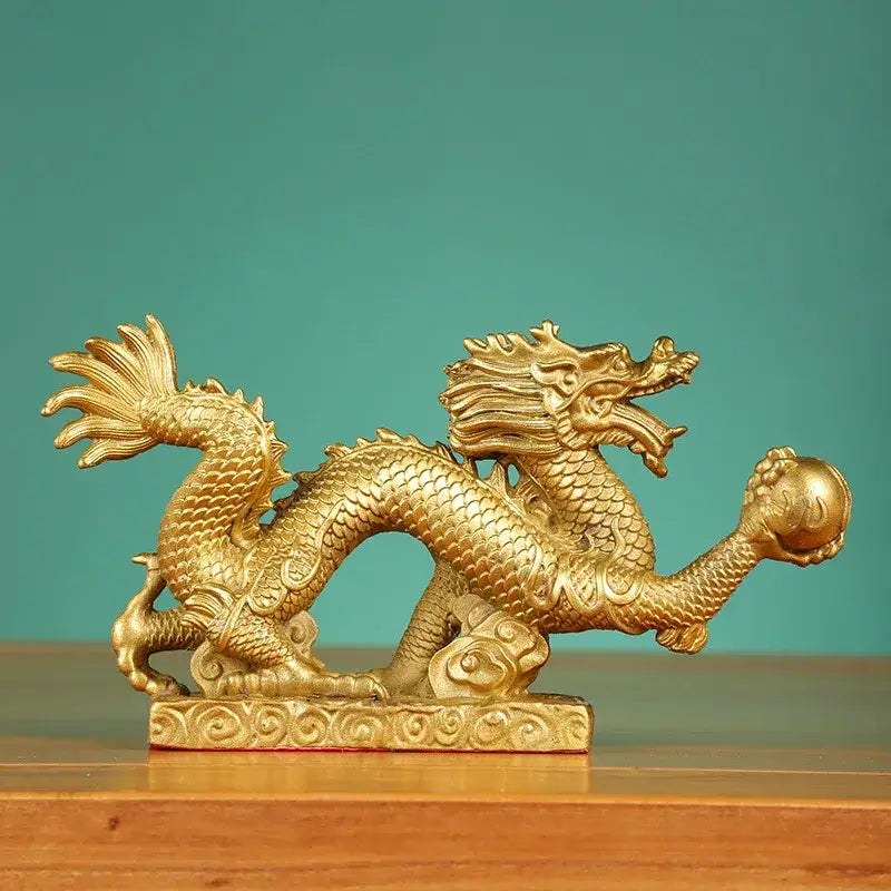 Golden dragon phoenix zodiac ornaments living room copper decor featuring intricate scales and flowing mane holding sphere