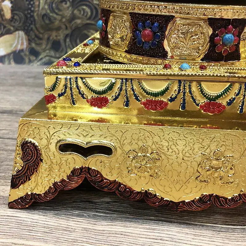 Golden alloy plates featuring eight auspicious buddha with ornate embossed patterns and gemstone accents for temple meditation