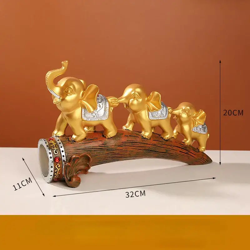Golden elephant resin ornament with silver saddle accents on detailed wooden log base for living room decorbites elephant resin