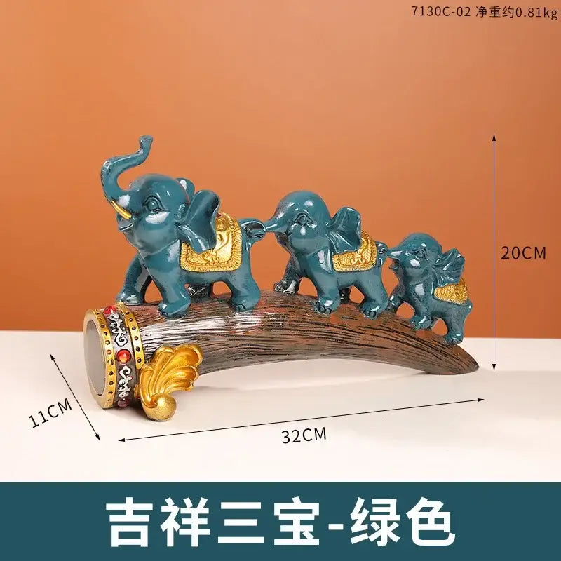 Teal decorbites elephant resin ornament with gold-trimmed saddles on wood-textured base for living room decor
