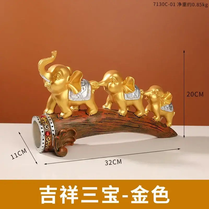 Golden elephant resin ornament featuring three elephants with silver saddles on wooden log base decorbites elephant resin