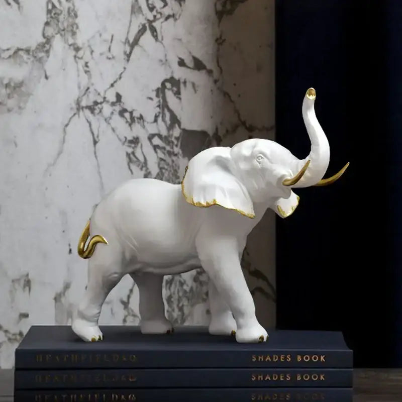 White ceramic elephant resin figurine with gold-trimmed ears tusks and tail for living room lucky decor by decorbites elephant resin