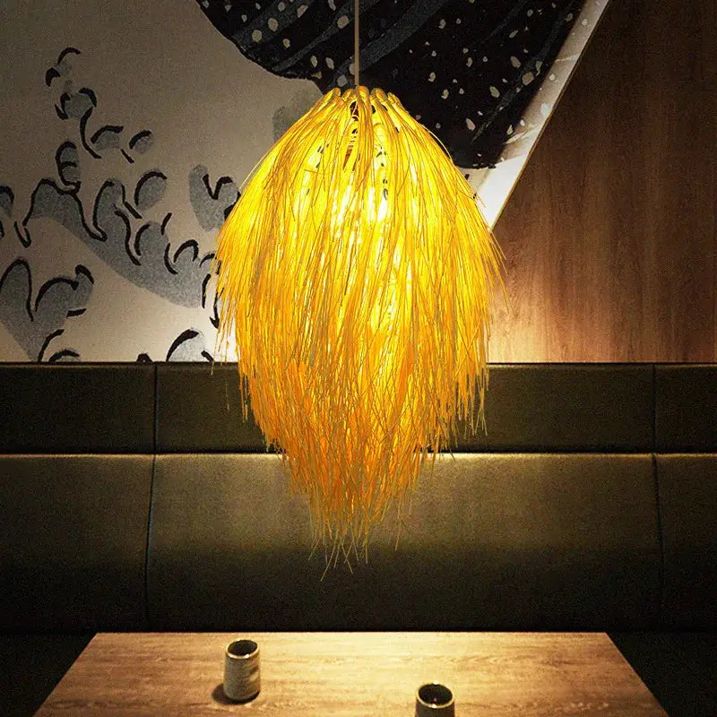 Golden feathery bamboo weave pendant lamp made of woven natural fibers ideal for bedroom lighting