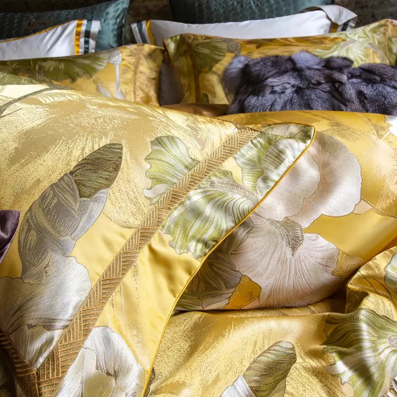 Golden floral satin jacquard bedding set pillow sham with intricate green and cream embroidery and subtle woven border