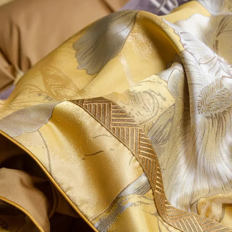Golden floral satin jacquard bedding set featuring a silk scarf with intricate silver and beige floral embroidery details