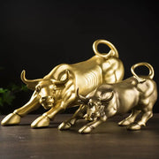 Two golden fortune resin sculpture bulls with detailed musculature and curled tails for office desk decor