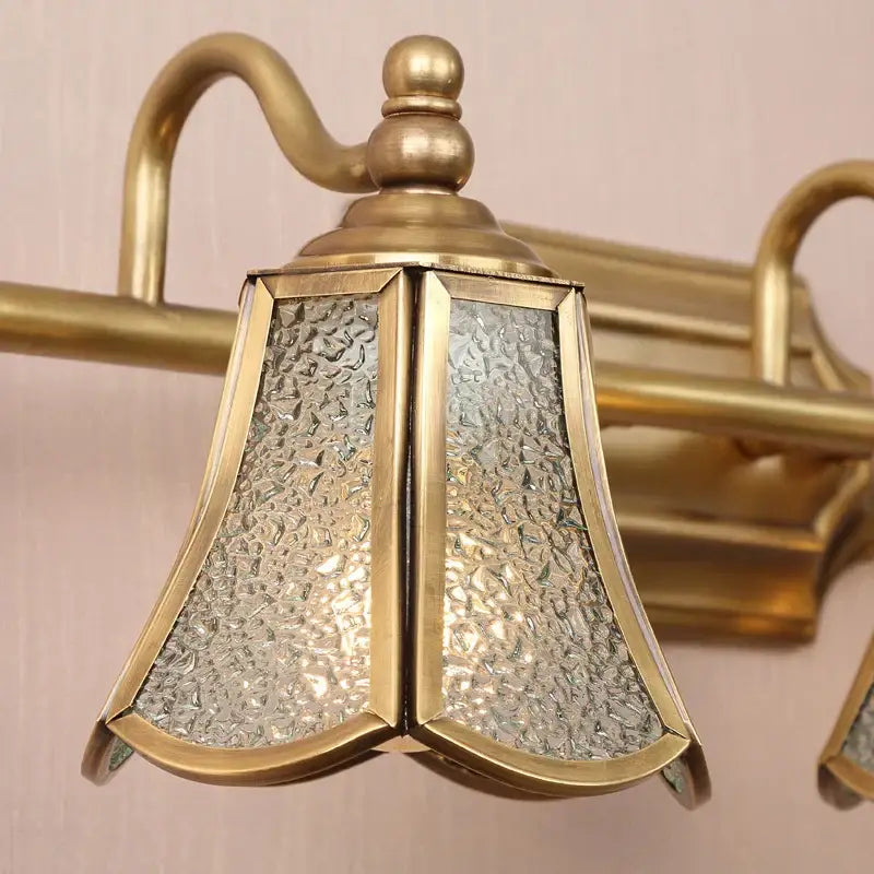 Antique brass-finished wall sconce with textured clear glass panels for decorbites golden glass mirror cabinet light
