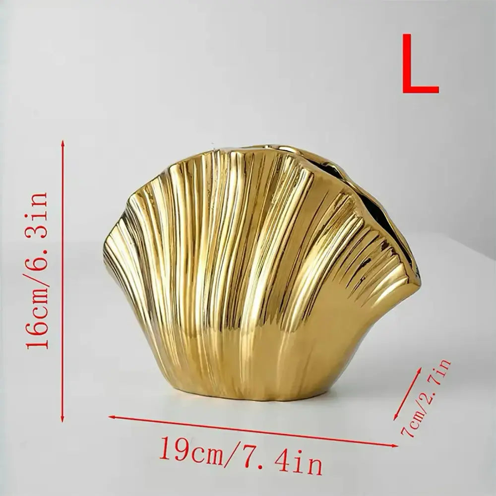 Golden glossy gradient shell ceramic vase shaped like a scallop shell with vertical ridges for living room decor
