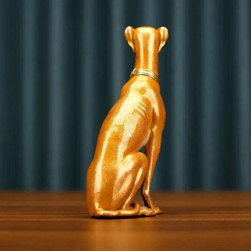 Golden metallic greyhound metal sculpture with sleek glossy finish and thin collar handcrafted for living room decor