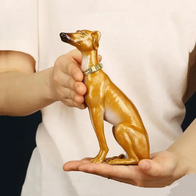 Golden ceramic greyhound metal sculpture with white underbelly and silver collar handcrafted for living room decor