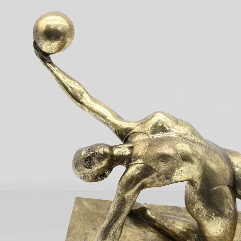 Golden metallic gymnast figurine ball sculpture in dynamic pose for elegant decorbites golden gymnast decor