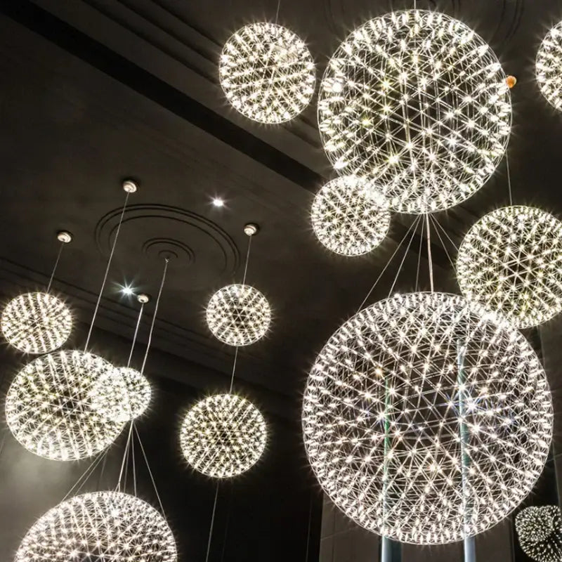 Golden gypsophila sparkball pendant lights featuring glowing spherical chandeliers with intricate wireframe designs