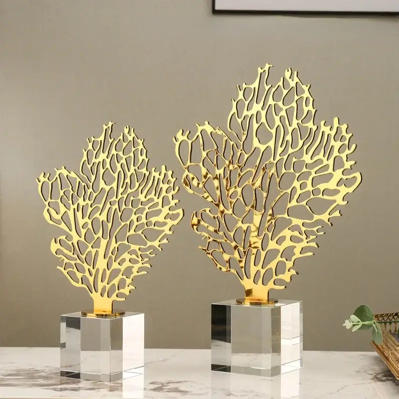 Golden hollow tree coral sculpture with intricate cut-out patterns on clear crystal bases for living room decorbites decor