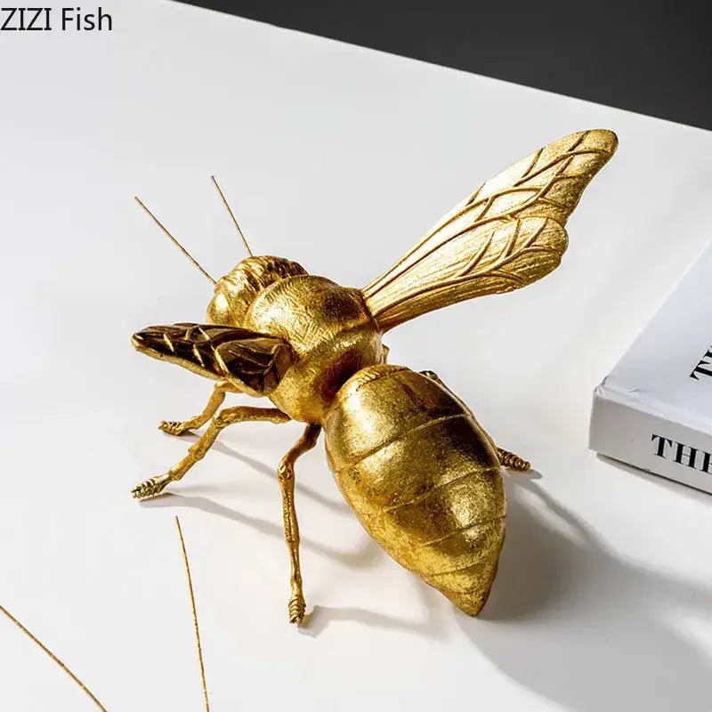 Golden honeybee insect statue with detailed segmented body and metallic finish for living room decorbites decor