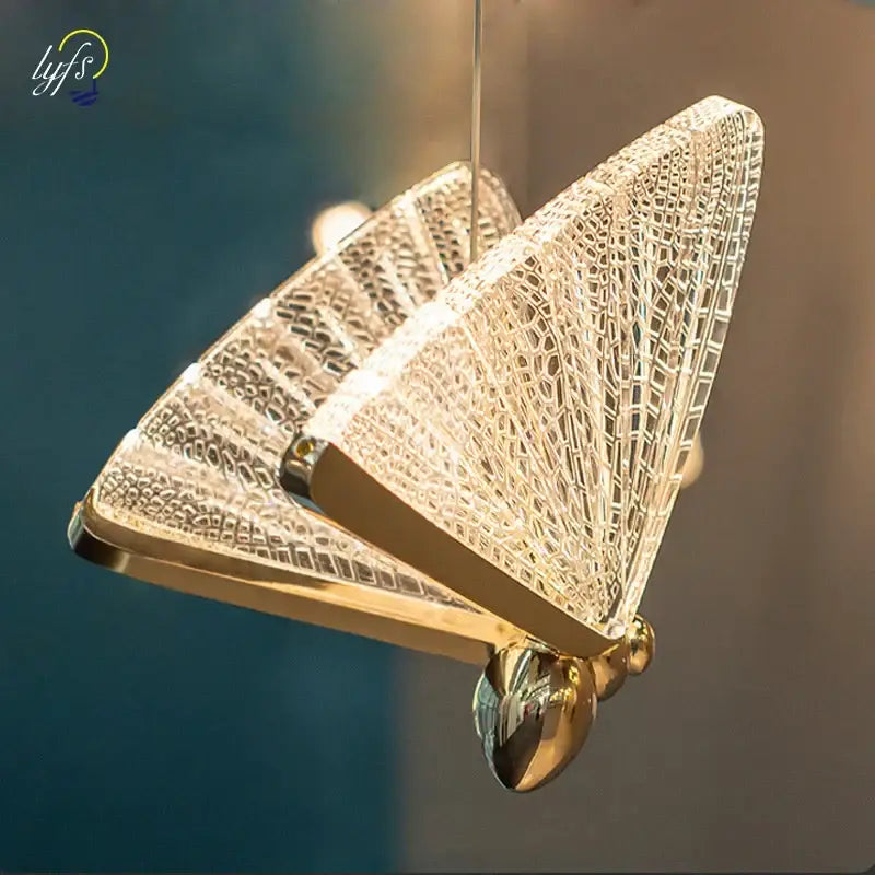 Gold-toned decorbites butterfly pendant light with crystal mesh wings and polished metallic body for living room decor