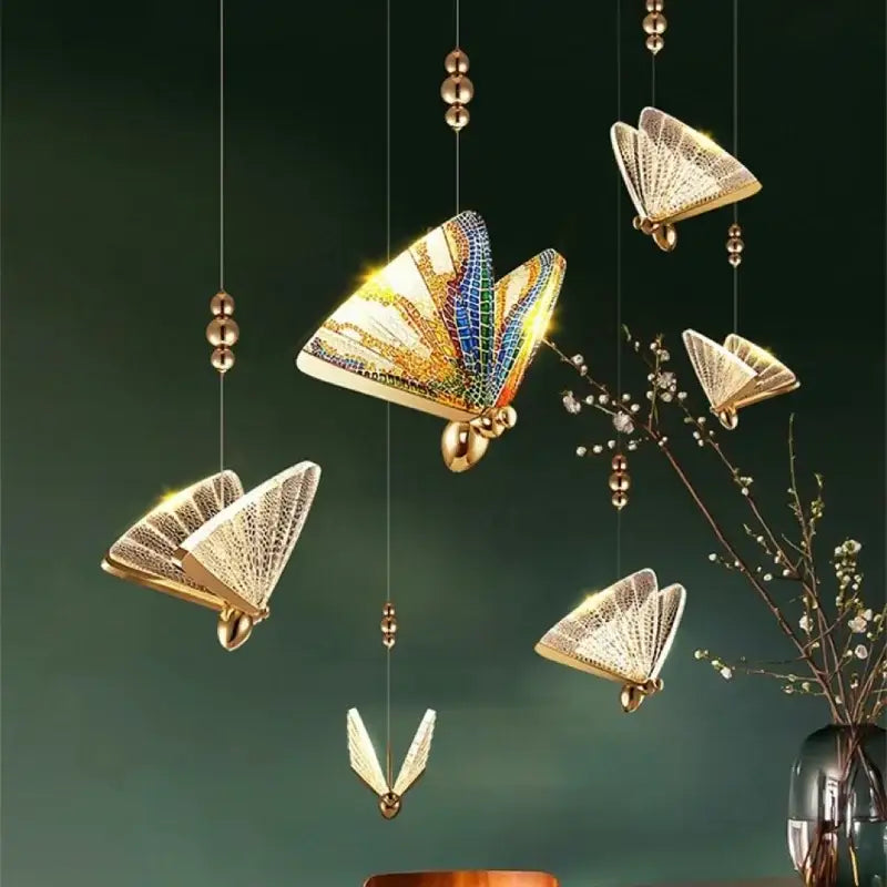 Golden iridescent crystal butterfly pendant lamp with gemstone-encrusted wings for elegant bedroom lighting decorbites crystal butterfly