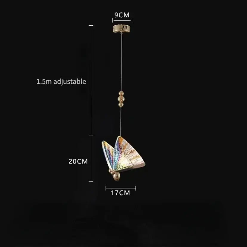 Golden iridescent crystal butterfly pendant lamp with iridescent wings and gold-toned metallic body for bedroom lighting
