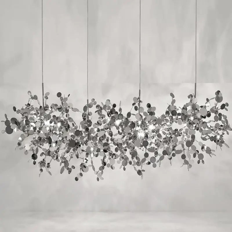 Silver leaf pendant light with reflective metallic discs suspended by thin cords for dining room decorbites g9 leaf lighting