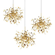 Three golden leaf pendant lights with intricate metallic branches and circular accents for dining room decorbites g9 leaf