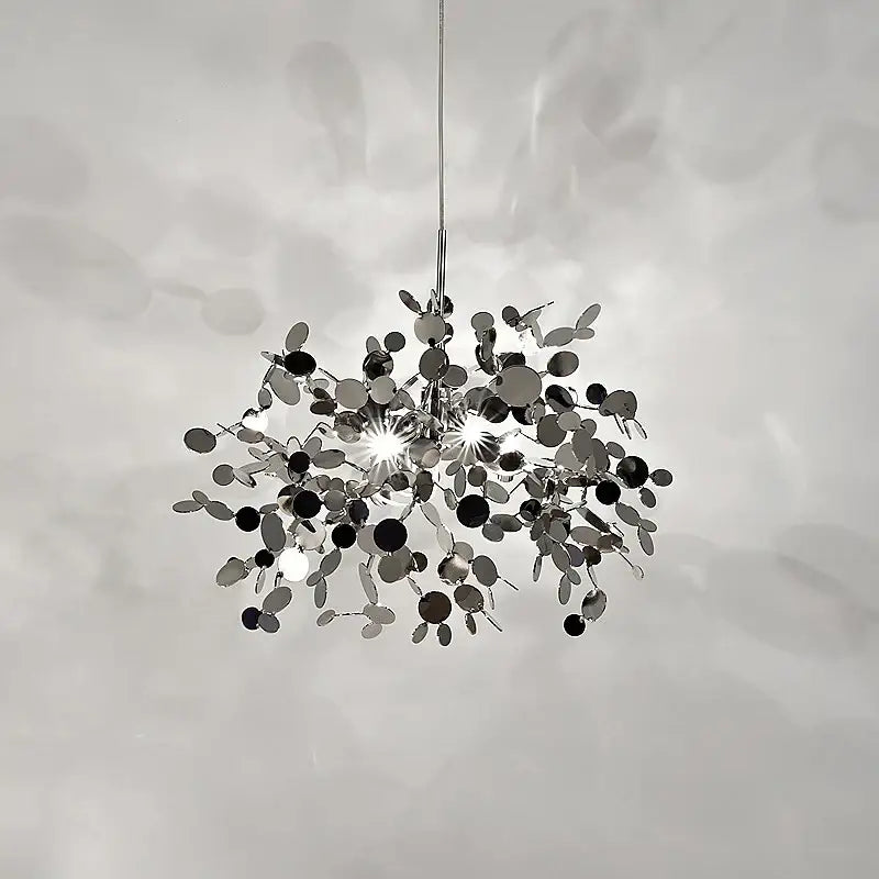 A modern chrome spherical pendant light with reflective discs for elegant dining room decorbites g9 leaf lighting