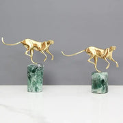 Two golden leopard brass figurines on green marble bases for elegant living room decor by decorbites golden leopard
