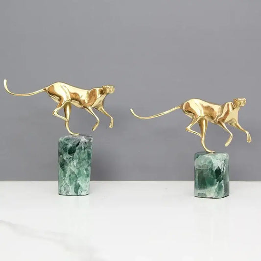 Two golden leopard brass figurines on green marble bases for elegant living room decor by decorbites golden leopard