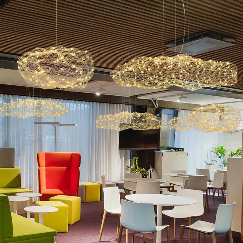 Golden mesh cloud pendant light with intricate wireframe design hanging in bedroom warm led decorbites cloud light