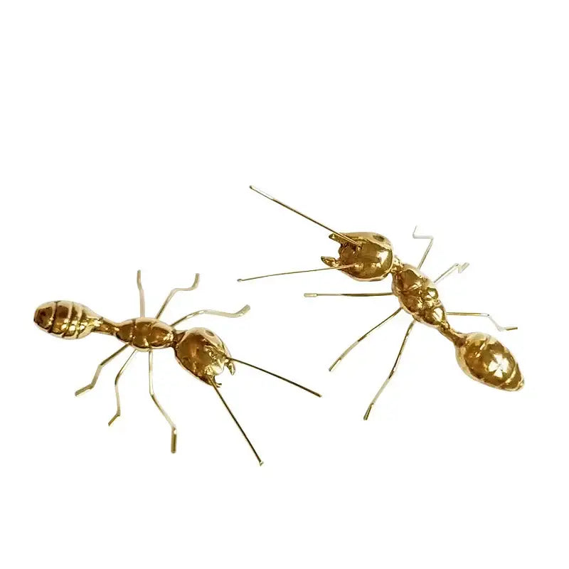 Golden metal ants decorative figurines with detailed segmented bodies and articulated legs for home decor