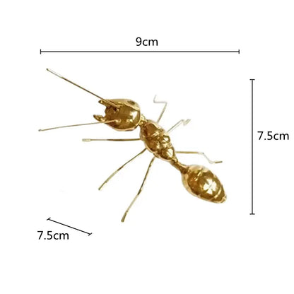 Golden metal ants decorative figurines featuring a 9cm long metallic ant with detailed segmented body for home decor