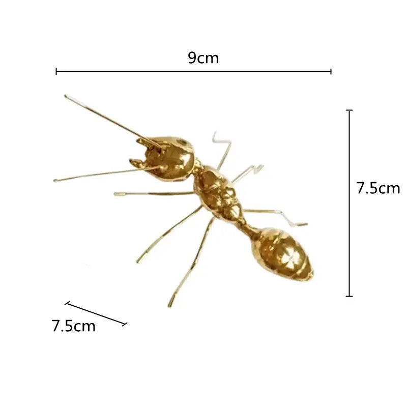 Golden metal ants decorative figurines featuring a 9cm long metallic ant with detailed segmented body for home decor