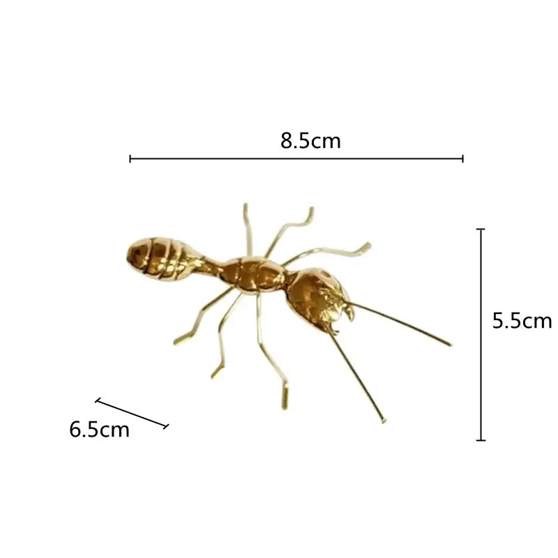 Golden metallic ant decorative figurine with detailed segmented body and articulated legs for home decor
