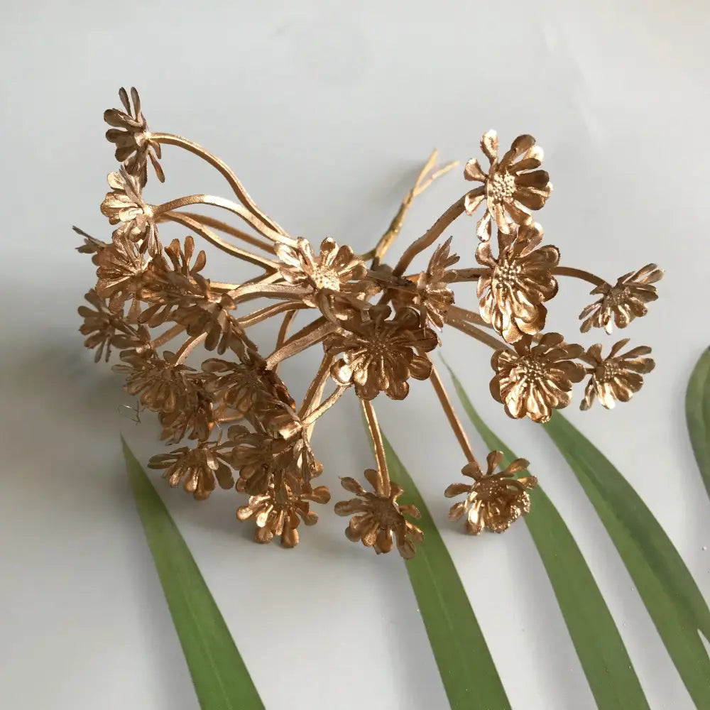 Golden metallic flower cluster hair accessory with berry stamen and green plant foliage for decorbites green plant decor