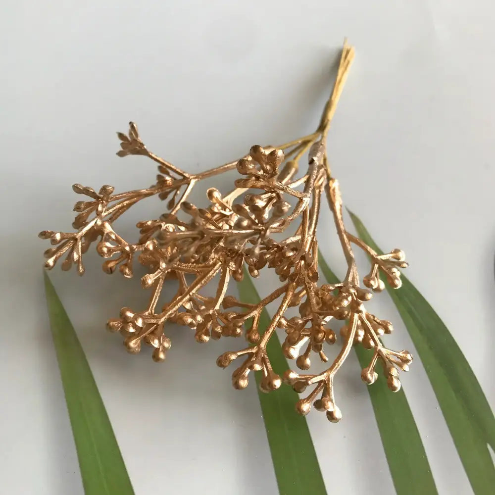 Golden metallic berry stamen green plant foliage with intricate stems and tiny buds for decorbites living room decor